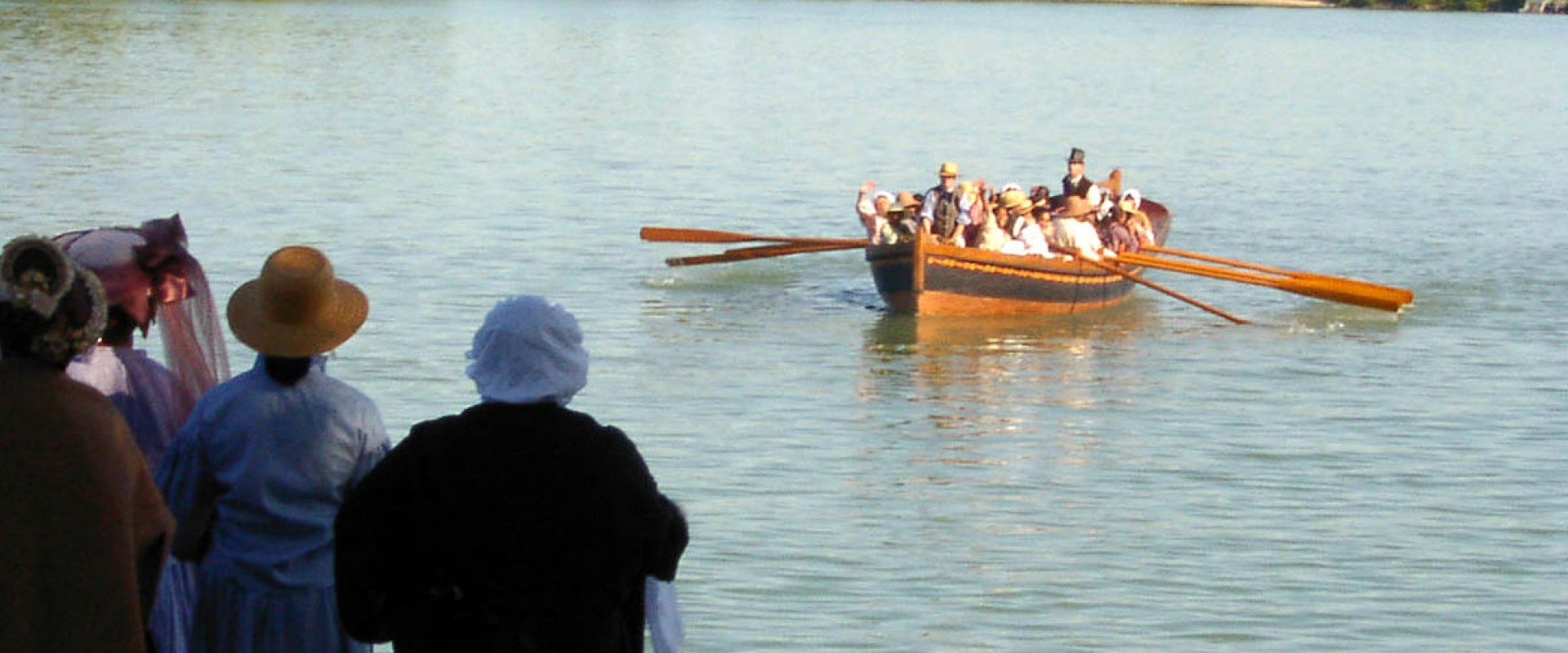 Re-enactment of 19th century travelers in a canoe through the underground railroad along the Detroit River. 