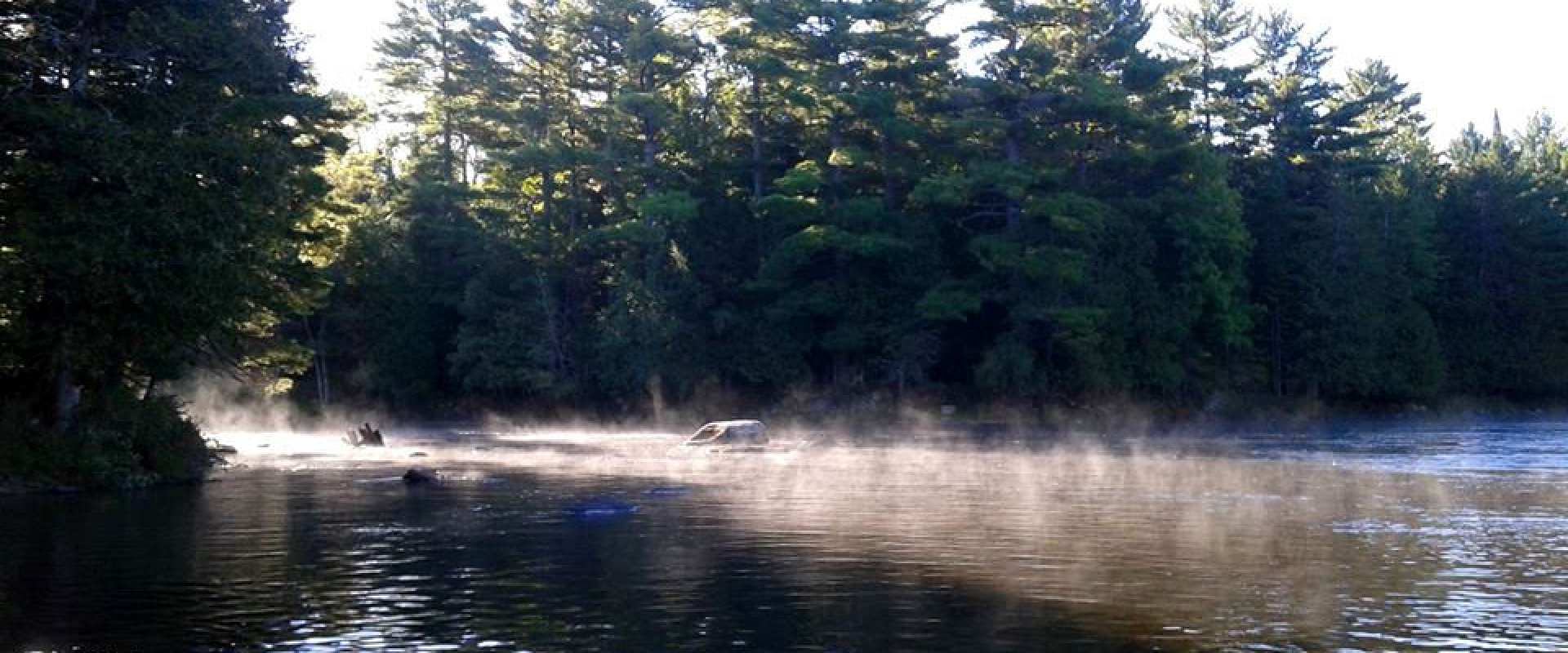 Mist glistens in the sunlight as it comes off the St. Croix River. 