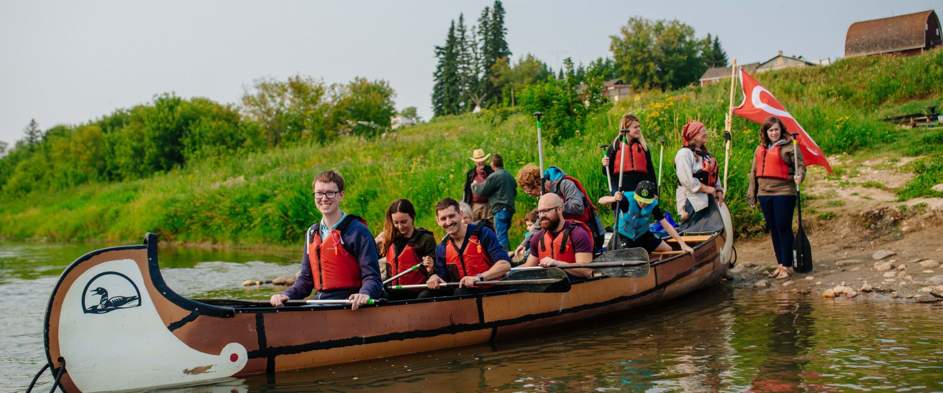  Embarking a Voyageur Canoe to ‘Paddle into the Past’ at Metis Crossing within the Victoria District National Historic Site of Canada in Smoky Lake County.
