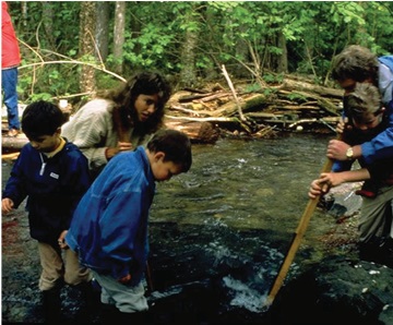 Elders educating some children about the Upper Restigouche River, New Brunswick