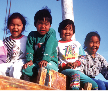 Aboriginal Heritage children smiling together at Soper River, Nunavut