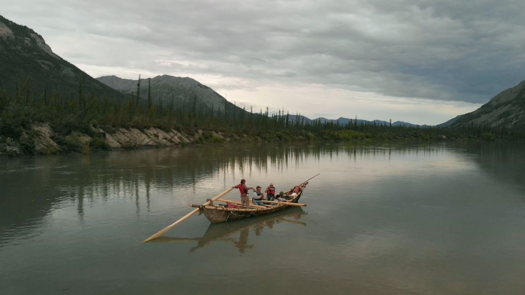 The production team travels down the Nahanni River in a traditional moosehide boat