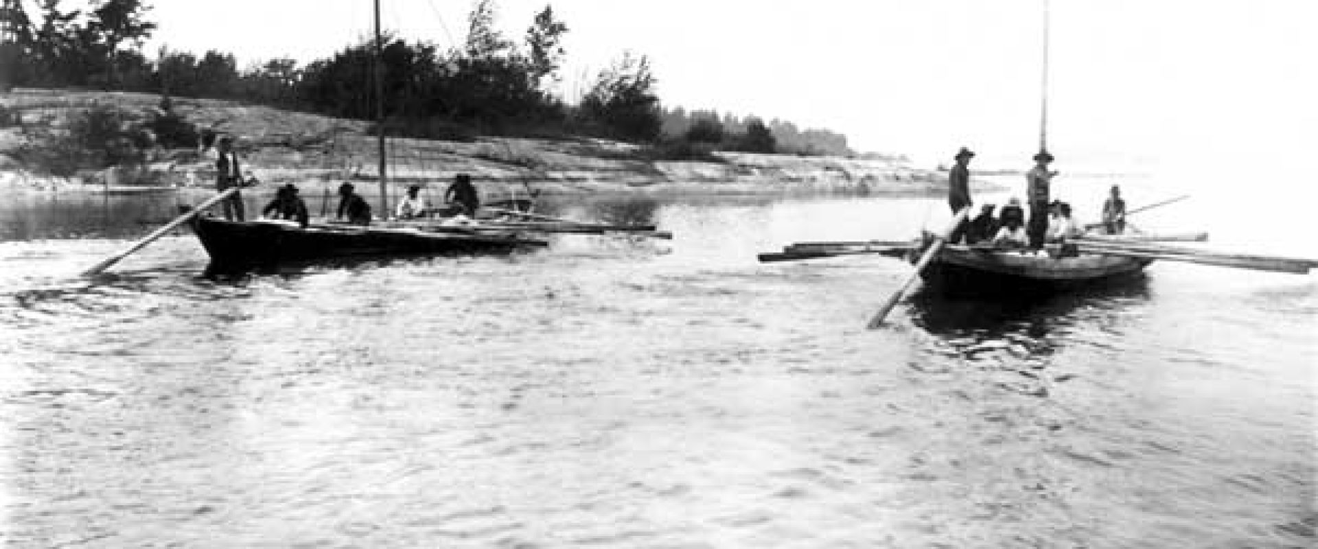 Black and white photo showing two york boats on the Hayes River near Norway House.